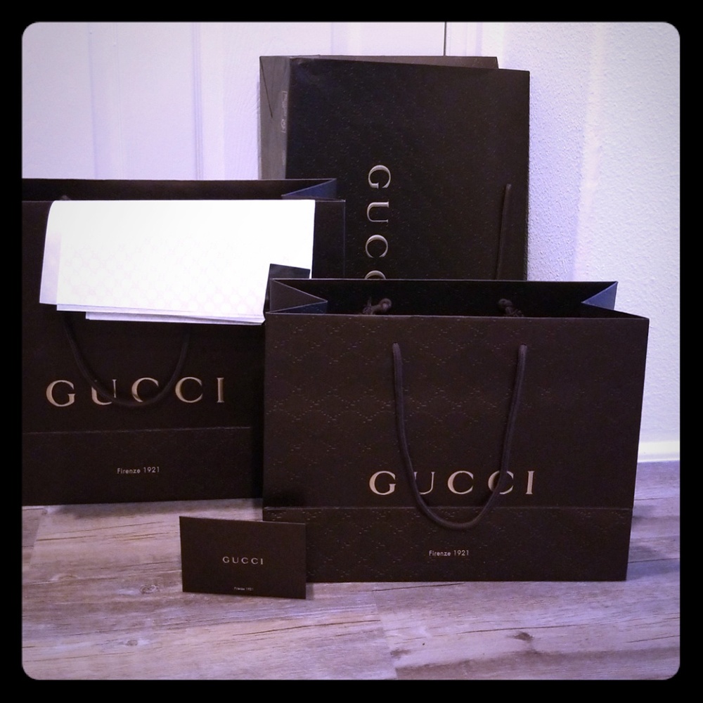 Gucci shopping bags, tissue paper, and reciept env